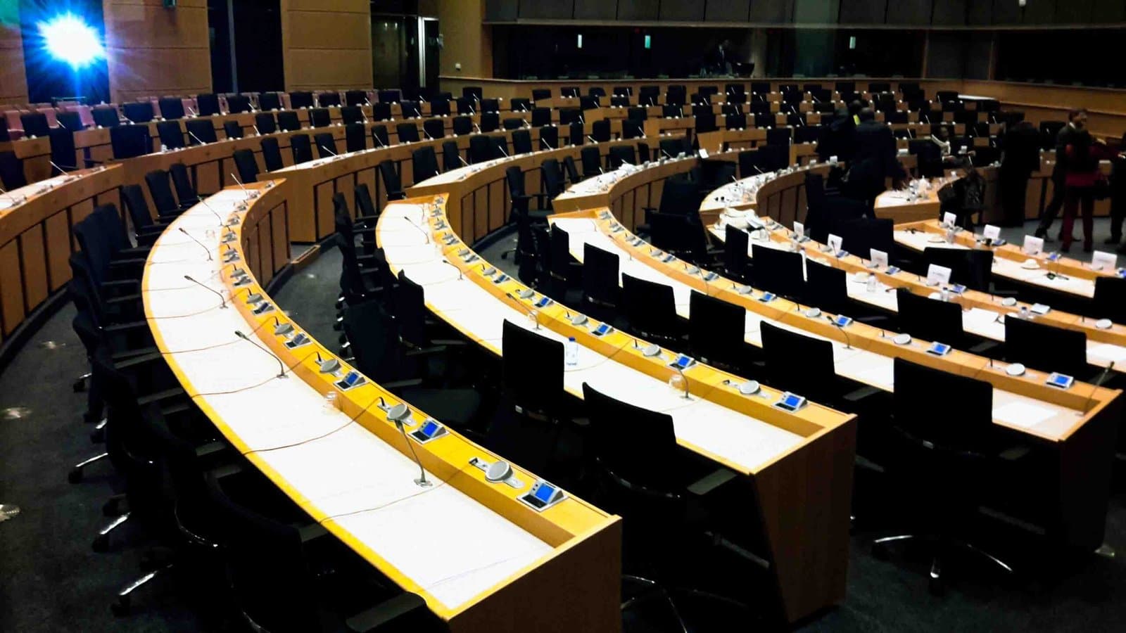 Delegates wearing headsets during simultaneous interpretation at an international conference